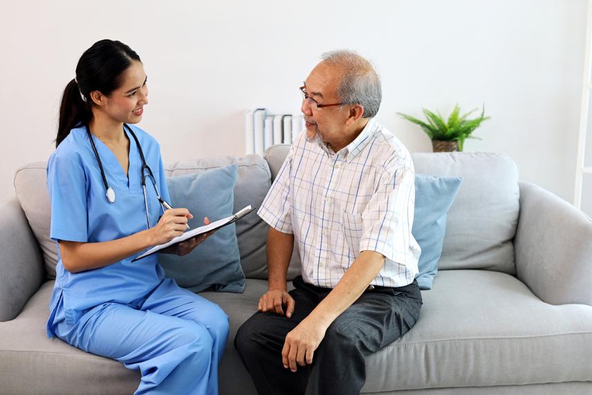 Nurse talking to patient about in-home health assessment